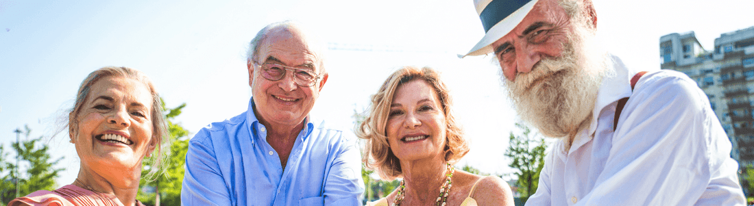 Group of happy seniors promoting natural digestive health supplements for wellness and detoxification