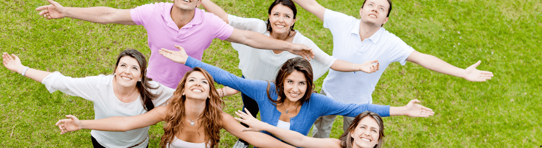 Group of people celebrating, representing community and support for herbal mental clarity boosters